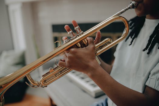 A detailed shot of a musician skillfully playing a trumpet in an indoor setting.