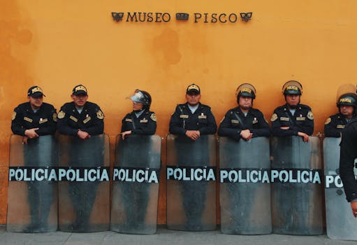 Peruvian police in uniform outside Museo del Pisco, Lima, Peru.